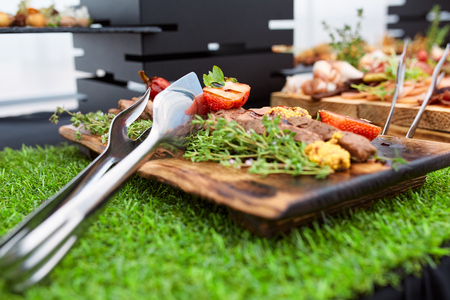 grilled steak with strawberry and french mustard with rosemary on a wooden boarの写真素材