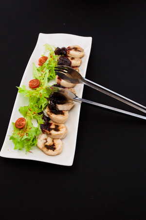 chicken steak with fresh grass and cherry tomatoes in the restaurantの写真素材