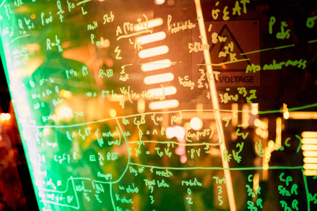 equation written by a marker on plexiglass in the restaurant as a piece of interiorの写真素材