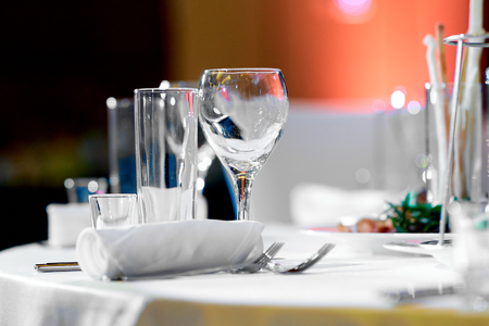Serving wedding table with cutlery and glassの写真素材