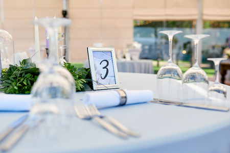 setting for guest wedding table with sign number threeの写真素材