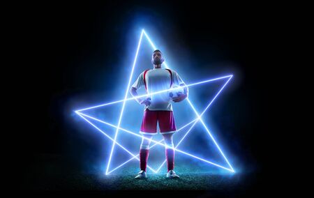 Soccer ball floating in space on an abstract backgroundの写真素材