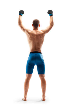 MMA fighter shows strength. Emotions of winner. sport victory. back view. isolated. Sportの写真素材