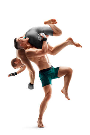 MMA fighting. side slam. Two fighters are fighting. sport concept. Isolated Menの写真素材