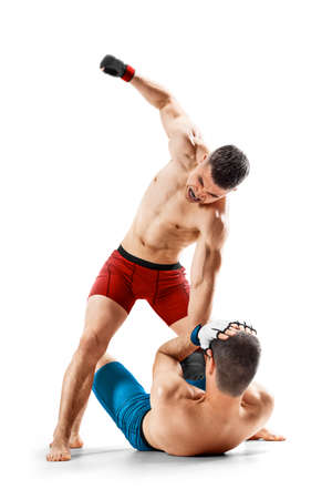 MMA punches. ground and pound. MMA Two fighters are crazy fighting. sport concept. Emotions of winner. isolated. Sportの写真素材