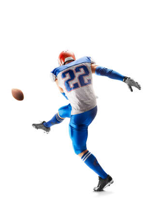 field goal. American football sportsman in action and motion. hitting the ball. isolated on white background. sport. Strongの写真素材