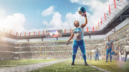 Joy in football. American football player celebrating victory at professional sports stadium during daytime. Human emotions and facial expressions concept. Manの写真素材