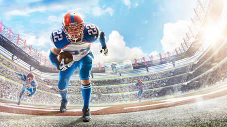 sports emotions. American football in a large open stadium. Young agile american football player...