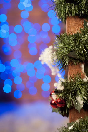 festive gifts, Christmas balls and garland lights on background. Festive New Year decoration.の写真素材