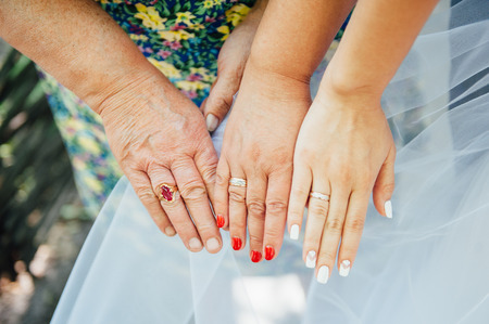 Happy love couple holding hands in the morning three generationの写真素材