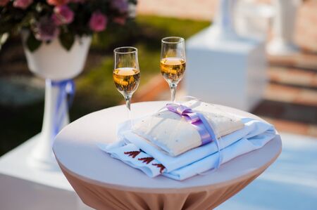 Wedding glasses filled with champagne at the banquetの写真素材
