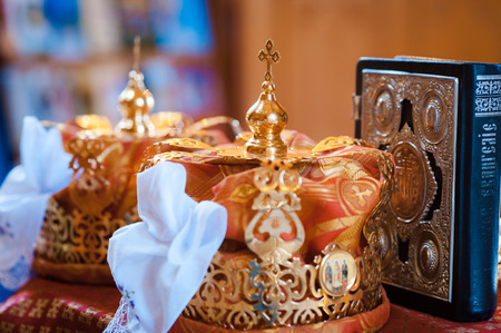 luxury golden crowns with stones for the wedding ceremony in the old church goldの写真素材