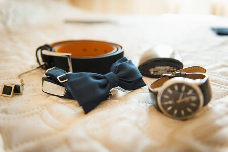 Set of groom clothes. Wedding rings, shoes, cufflinks and bow tie detalisの写真素材