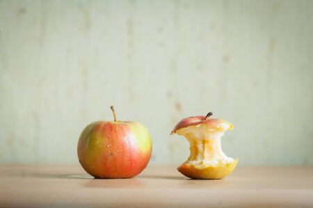red apple stump with apple on the boardの写真素材