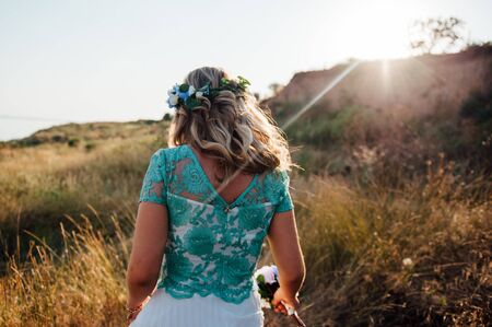 beautiful girl with a wreath on his head is in parkの写真素材