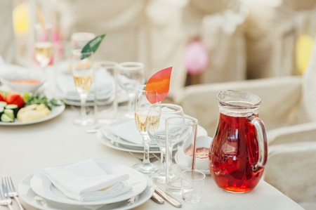 Wedding glasses filled with champagne at the banquetの写真素材
