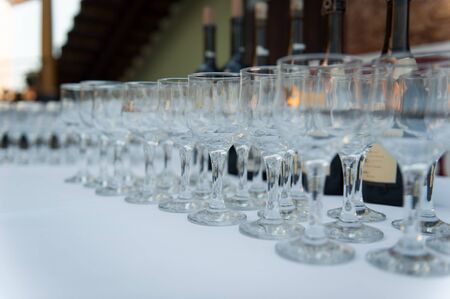 Wedding glasses filled with champagne at the banquetの写真素材
