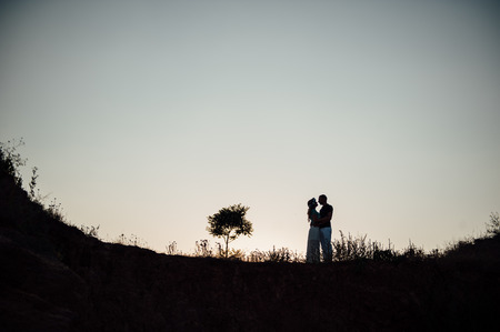 Couple lover holiday happy silhouette sky sunset cloudsの写真素材