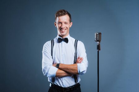 portrait of a man with retro style microphone.