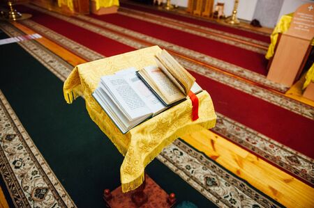 Wedding table priest with the Bible , a crown and a towelの写真素材