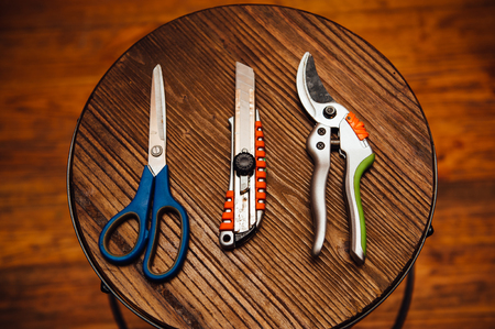 Set of plant care utensils on wodden plate.の写真素材