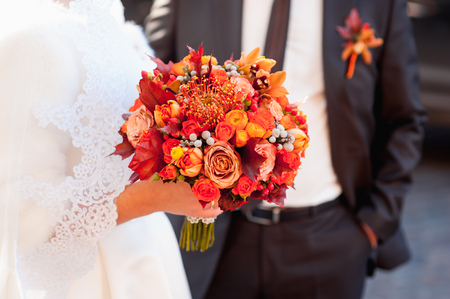 Beautiful wedding bouquet in hands of the bride.の写真素材