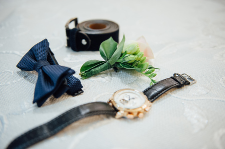 Set of groom clothes. Wedding rings, shoes, cufflinks and bow tie detalis fashionの写真素材