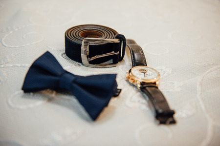 Set of groom clothes. Wedding rings, shoes, cufflinks and bow tie detalis fashionの写真素材