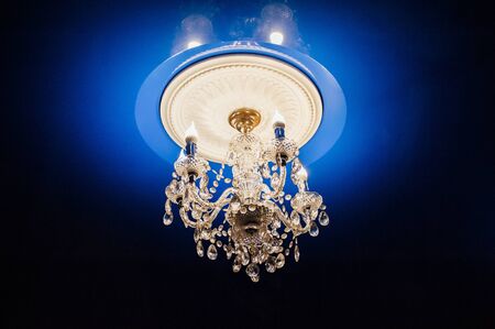 modern glass chandelier premium to the ceiling with light flaresの写真素材