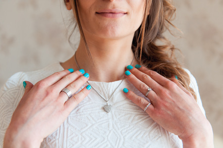the bride wears a necklace around his neck.の写真素材