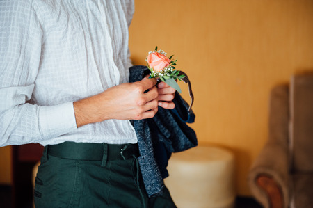bride in a white shirt holding hands flower.の写真素材