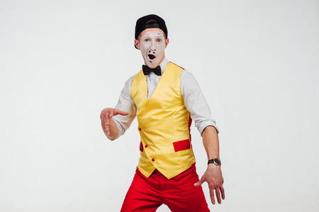 studio shot of two mimes isolated on a white backgroundの写真素材