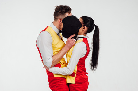 studio shot of two mimes isolated on a white background. They covered themselves with baseball capの写真素材