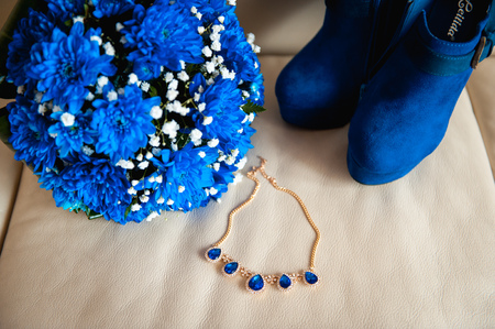 bouquet bride necklace boots on a beige fabric.の写真素材