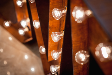 Vintage electric lamps scenery with wooden planks.の写真素材