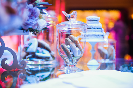 eco-friendly French makarons cake on the table. With purple lightingの写真素材