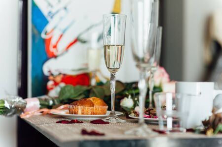 Wedding glasses filled with champagne at banquet.