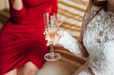 Girls are smilling and have party celebration. in white and red dressesの写真素材