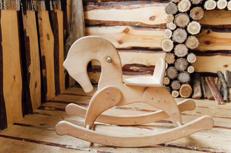 Old rocking horse on a rustic country backdrop.の写真素材