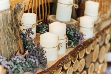 Wedding decorations with candles. with wooden logsの写真素材