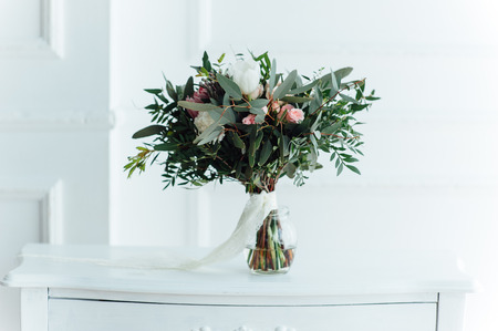 beautiful modern wedding bouquet on wooden planks.の写真素材