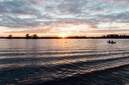 Landscape of river with beautiful of the sunset on colorful of sky and cloudの写真素材
