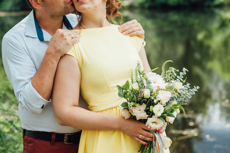 Beautiful wedding bouquet in hands of the bride.の写真素材