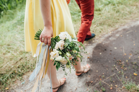 Beautiful wedding bouquet in hands of the bride.の写真素材