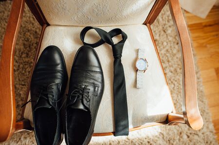 Set of groom clothes. Wedding rings, shoes, cufflinks and bow tie detalis fashionの写真素材