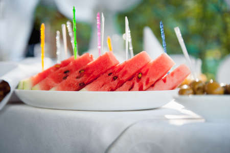 Watermelon slices on cocktail party. sunny dayの写真素材