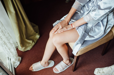 Beautiful hands of a girl in a lace negligee.の写真素材