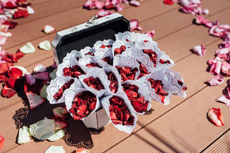 top view of envelopes with rose petals for visiting or wedding ceremonyの写真素材