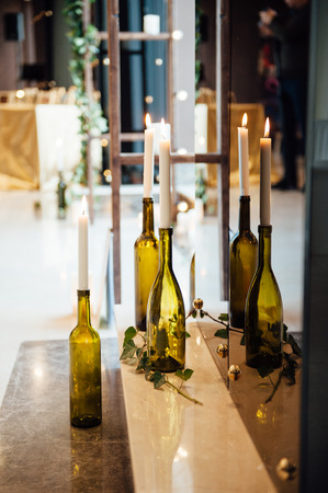 Candles in bottles on stairs. Vintage look.の写真素材