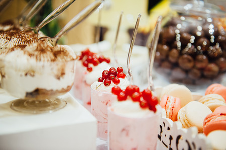 eco-friendly variety cake on the festive table. wonderful dishes with berries. beautiful and...